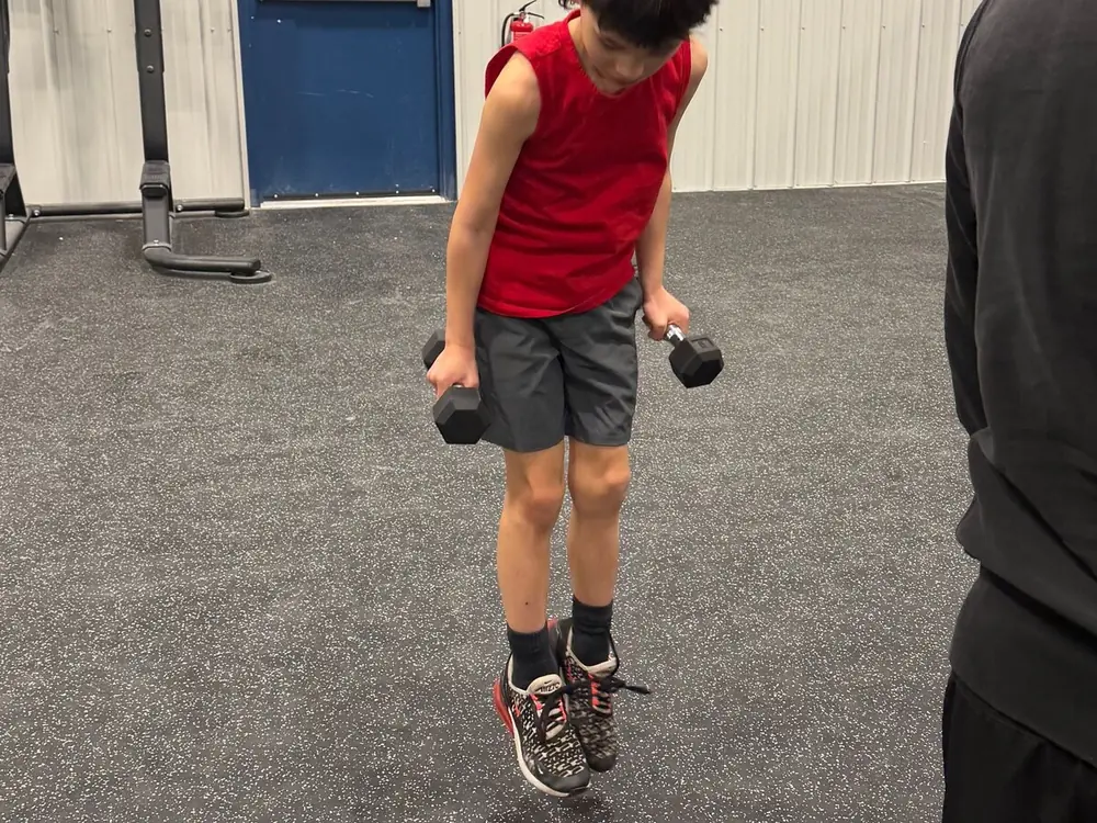 A boy jumping rope during kids' cross-training